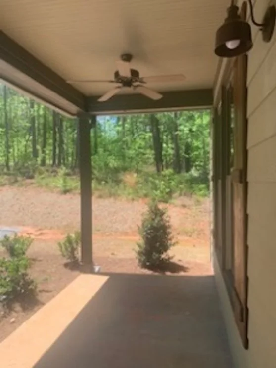 Grace Valley Retreat Center — screened porch of the completed cabin