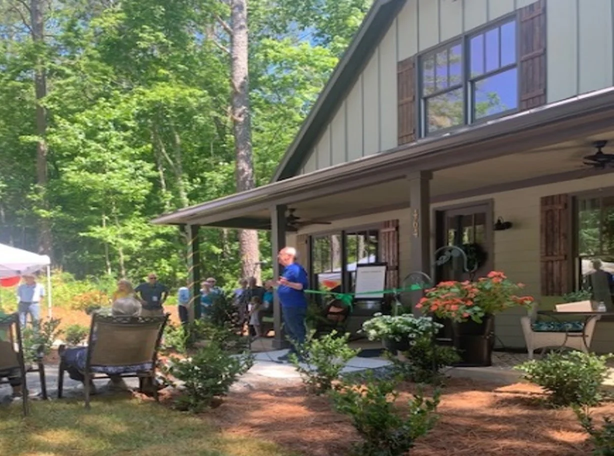 Grace Valley Retreat Center — guests gathered on the completed cabin deck