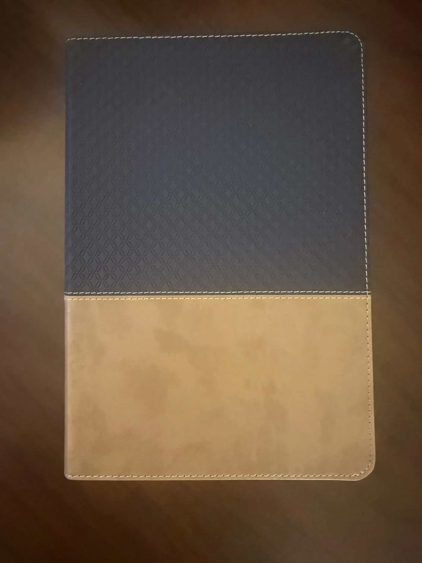 The navy and tan leather TIH closing Bible